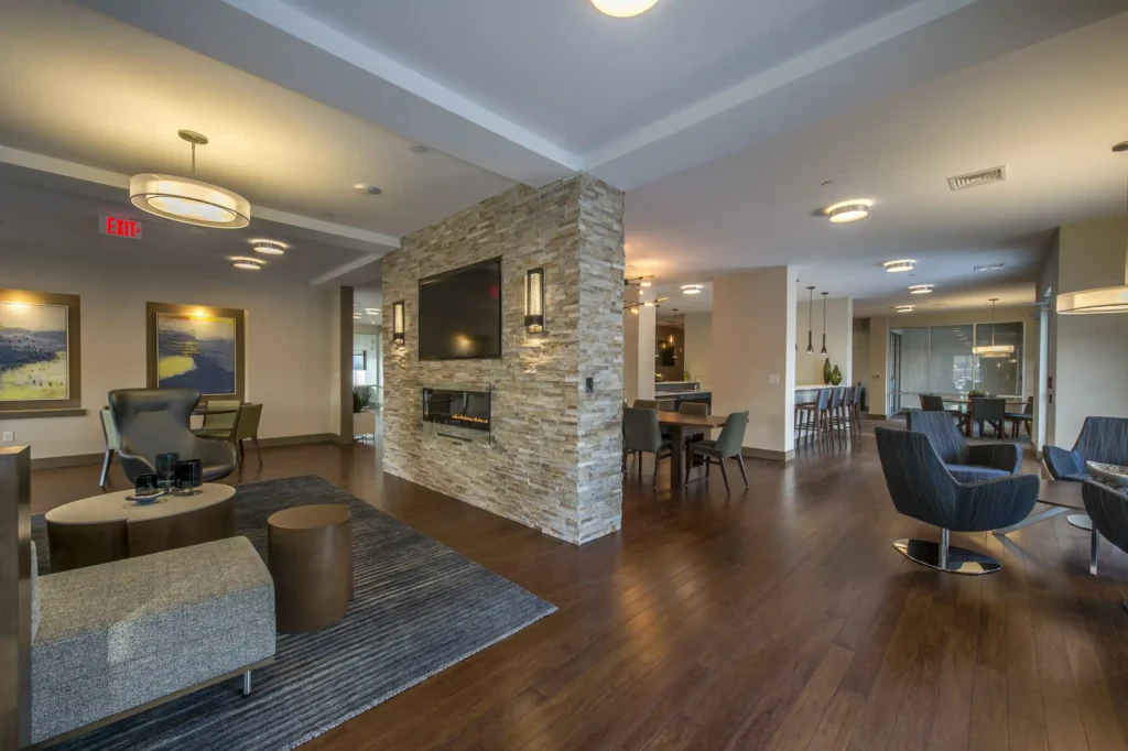 Clubhouse lunge with fireplace, TVs, and sofas