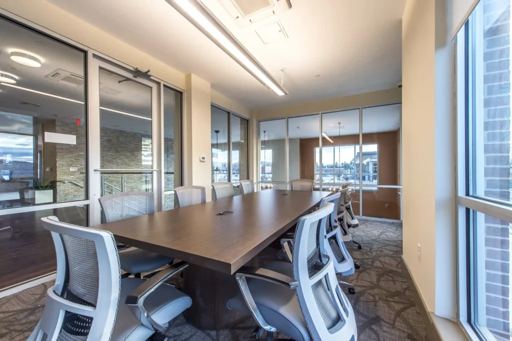 Conference room with large table and windows